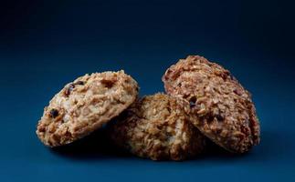 Handmade oatmeal cookies on a blue background. Rustic oatmeal cookies. photo