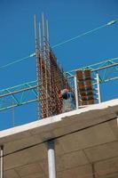 Construction formwork, reinforcement for the construction of buildings. Workers make a concrete structure photo