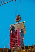 Construction formwork, reinforcement for the construction of buildings. Workers make a concrete structure. photo