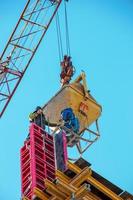 Construction formwork, reinforcement for the construction of buildings. Workers make a concrete structure photo