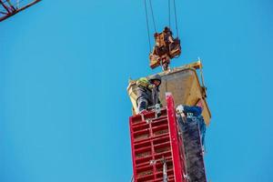 Construction formwork, reinforcement for the construction of buildings. Workers make a concrete structure. photo