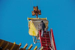 Construction formwork, reinforcement for the construction of buildings. Workers make a concrete structure. photo