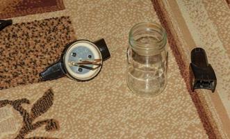 The process of cleaning the carpet with a vacuum cleaner with a water filter. Nozzle for the vacuum cleaner for formation of the cleaning foam photo