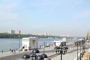 Embankment in river station pier. Starting point of cruise tourism ships. Passenger terminal. Pedestrian park photo