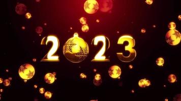 Schleife 2023 mit goldenen Weihnachtskugeln auf schwarzem Hintergrund