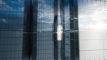 modern glass skyscraper exterior with sunshine and reflection on the windows video