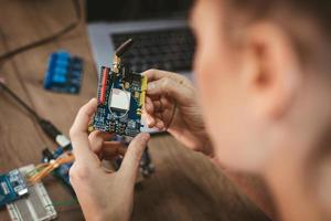 Engineer Working On Circuit Board photo