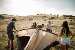 It Takes Teamwork To Set Up Their Tent photo