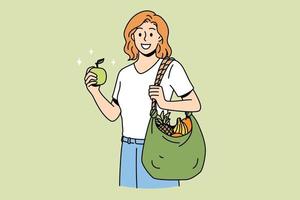 concepto de estilo de vida y alimentación saludable. joven personaje de dibujos animados de mujer sonriente de pie con bolsa de compras llena de frutas frescas después de la ilustración de vector de mercado