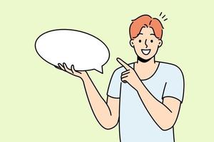 Smiling young man holding speech bubble in hands. Happy guy point at mockup empty blank copy space for advertising. Vector illustration.