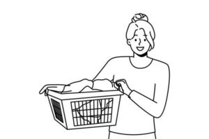 Smiling young woman with basket with clothes going to laundry. Happy girl cleaning clothing in laundromat. Vector illustration.