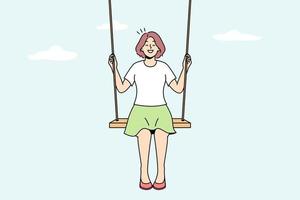 una joven sonriente se sienta en un columpio en las nubes soñando. niña feliz balanceándose en inclinación en el cielo. soñador y visualización. ilustración vectorial vector