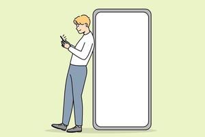 joven parado cerca de un enorme teléfono inteligente con pantalla de maqueta. el tipo posa cerca del teléfono celular con una pantalla vacía de espacio de copia en blanco. ilustración vectorial vector