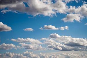 Blue sky with fluffy clouds photo