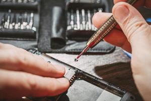 Man Repairing A Mobile phone photo