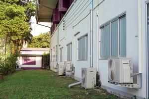 air conditioner compressor installed on the outside of the building. Soft and selective focus. photo