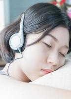 Young asian woman short hair listening music photo