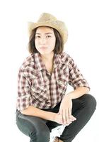 Young woman in a plaid shirt posing in studio on white background photo