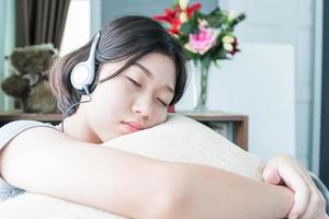 Asian woman short hair listening music photo