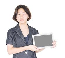 Woman holding up  blank tablet computer photo