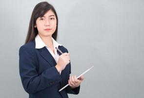 Woman in suit using computer digital tablet photo