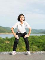 Woman doing exercising and warm up outdoor photo