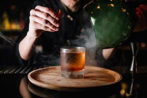 beautifully decorated cocktail in a nightclub, people drink a drink photo