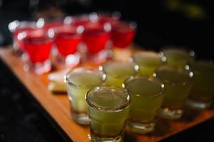 beautifully decorated cocktail in a nightclub, people drink a drink photo