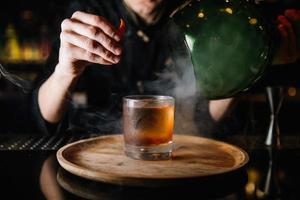 beautifully decorated cocktail in a nightclub, people drink a drink photo