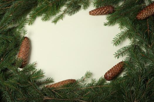New Year's Eve background with fir branch and cones. Christmas and New Year holidays composition of pine tree branches. photo