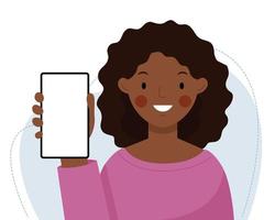 una linda niña africana sostiene un teléfono en sus manos. la mujer muestra un teléfono vacío y sonriendo. vector