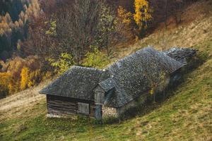 Colorful autumn landscape in the mountain village. Foggy morning in the Carpathian Mountains in Romania. Amazing nature. photo