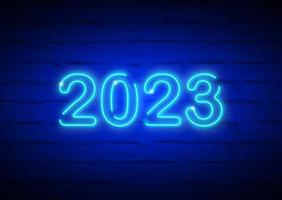 2023 New Year glowing blue neon signboard on brick wall. Vector illustration Happy New Year neon realistic sign banner, season fashion design