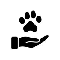 pata animal e icono de silueta de mano humana. concepto de donación, cuidado y protección de animales. adopción de mascotas, refugio, ícono de caridad. pictograma de bienestar animal. ilustración vectorial vector