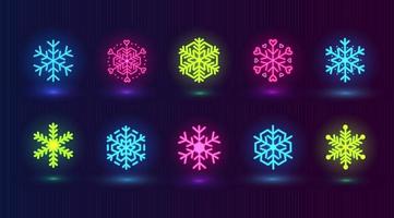 Vector set with neon colorful snowflakes. Winter pink, blue, green icons on dark blue background.