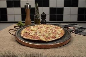 Brazilian pizza with mushroom, cheese and ham photo