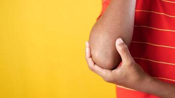 Man feels his elbow, muscular pain video