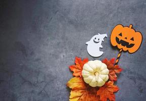 Flat lay of halloween prop for decoration and party on dark stone background with copy space, holiday concept photo