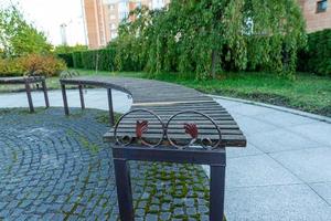 romantic bench in a quiet Park in summer photo