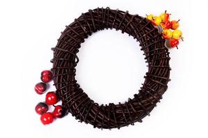 Wreath woven from the branches of the vine isolated , Place for text photo