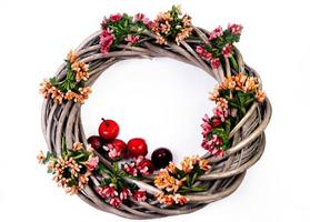 Wreath woven from the branches of the vine isolated , Place for text photo