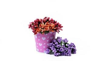 aluminum ice bucket laid in wait for use. stainless multi-colored bucket with green blue flowers photo