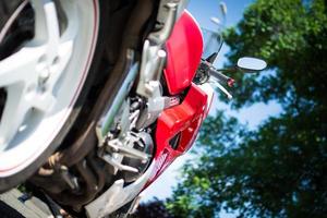 rear view of classic motorcycle with exhaust chrome pipes. photo