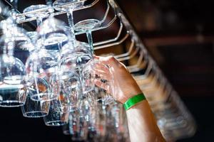 People clinking glasses with wine on the summer terrace of cafe or restaurant photo