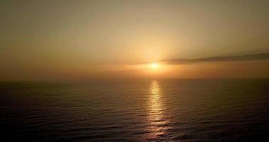 Drone video of a beautiful sunrise or sunset on the sea or ocean.