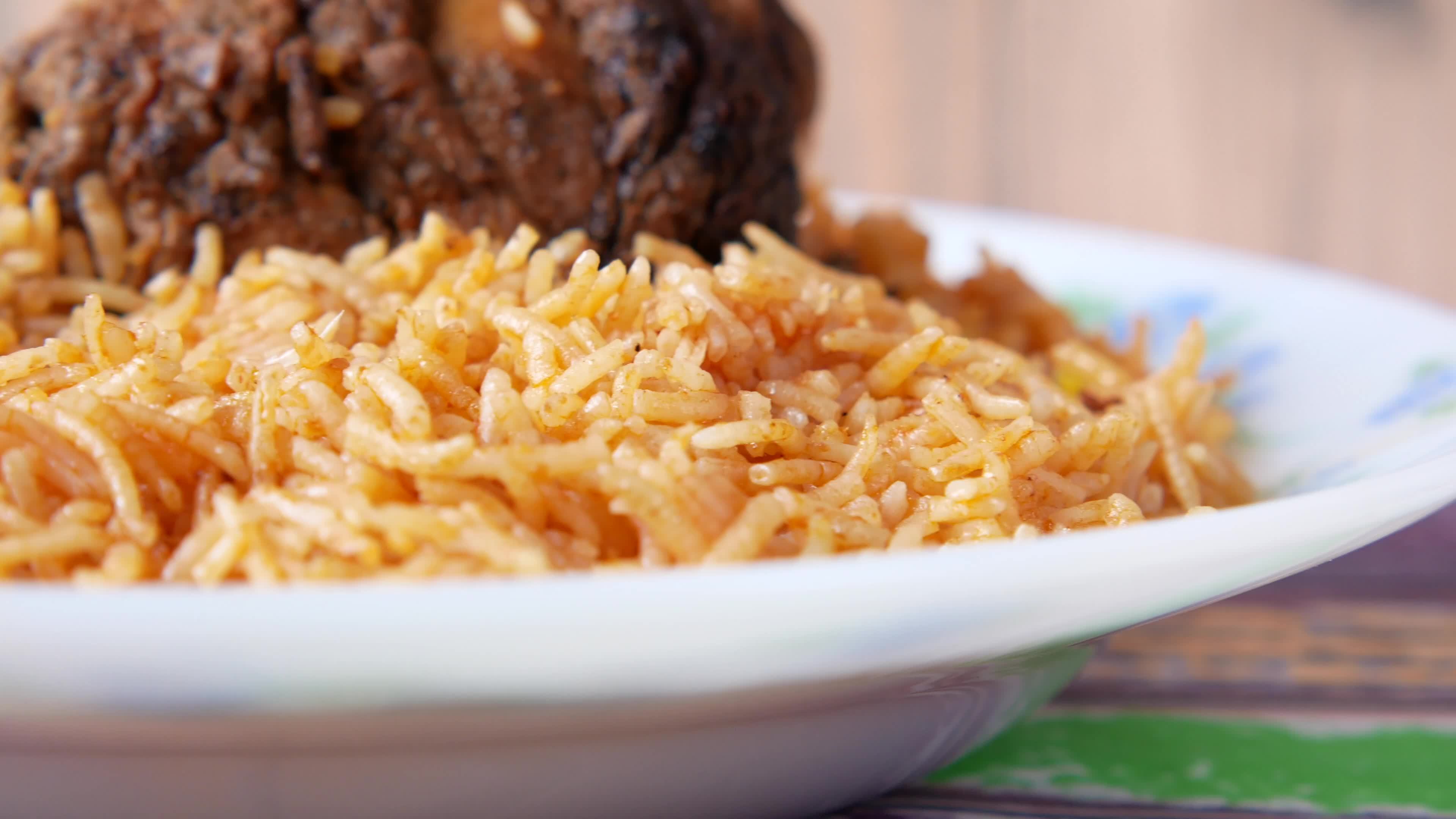 Chicken and rice dish, close up 13748946 Stock Video at Vecteezy