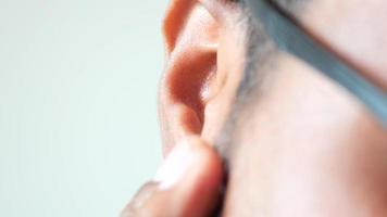 Close up of man rubbing ear video