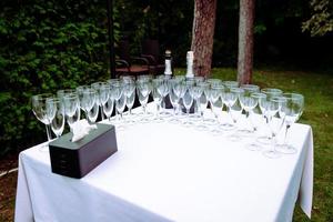 many wedding glasses with sparkling wine in restaurant photo