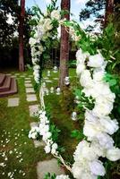 Wedding ceremony. wedding arch, decorated with various fresh flowers photo