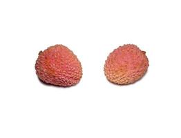 Lychee on the table. Chinese plum on a white background. Ripe fruit from Asia. Delicious  product. photo